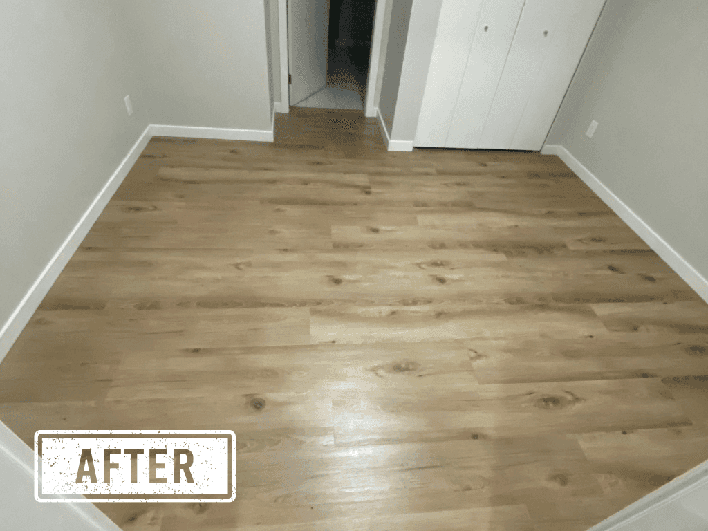 Room after — new laminate flooring installed