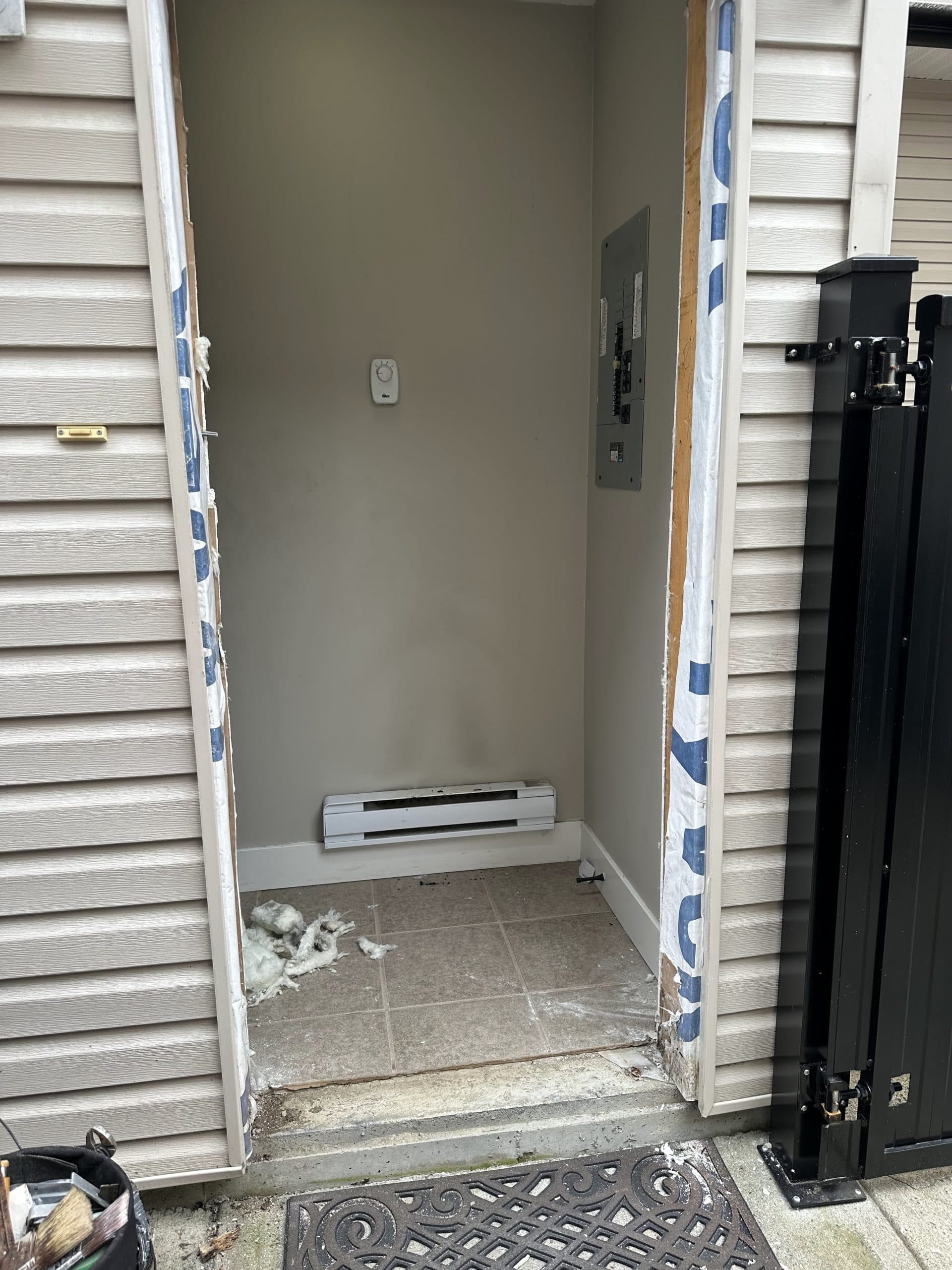 Exterior door before — old door